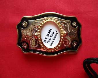 Gold Tone with black trim belt buckle to hold hold a 18 by 25 mm cabachon.