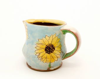 Blue sunflower themed Earthenware pitcher/creamer. Wheel thrown and altered, food safe, made by Kaitlyn Brennan/ Brennan pottery