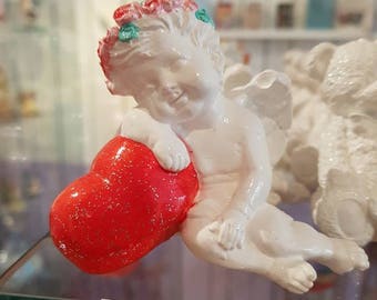 Cherub Angel on a statue, hand-made heart