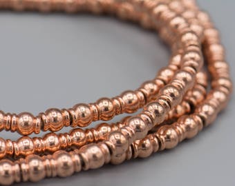 85 Copper Barrel Beads 6x7mm on a 24" Strand SKU-MTB6X7C-177