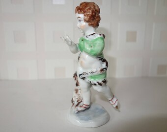 Ice skating Putti fine porcelain figurine with N under crown stamp
