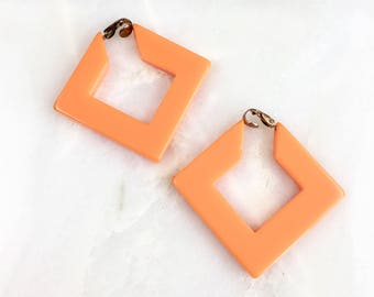 Vintage Orange Bakelite Clip On Earrings