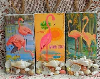Darling trio set of vintage flamingos on hanging tiles.