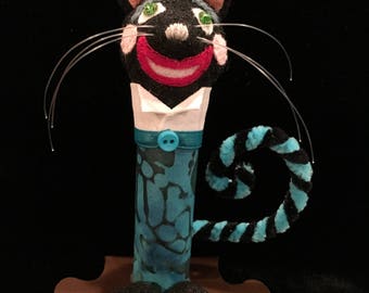 Cheshire Cat from Alice in Wonderland. Approx 4 3/4" tall & 3/8 oz weight.