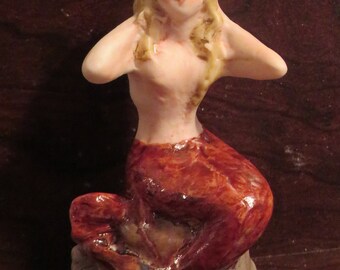 Bisque Mermaid in a sitting position Figurine