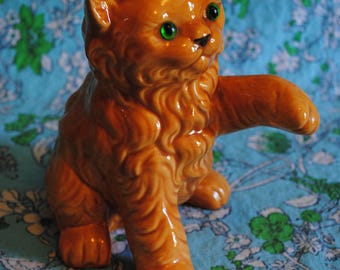 Orange Ceramic cat with green eyes