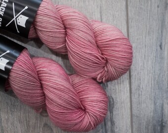 DK weight merino yarn 100% Superwash Merino Sweater weight yarn. Double Knit Weight yarn. Chansey. Semi-Solid pink yarn.