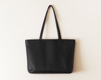 Black leather tote bag with zipper