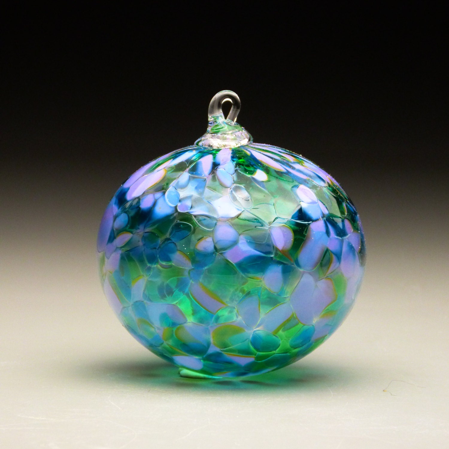 hand made blown glass Christmas ornament in tones of lavender
