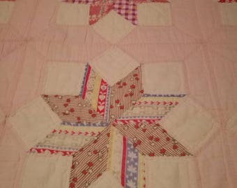 Twinkling LeMoyne Star or Twinkling Diamond Star with pale pink border!