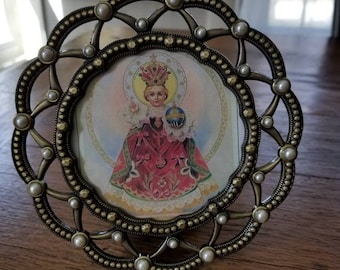 Infant of Prague picture.....circular vintage frame...metal...embedded faux pearls