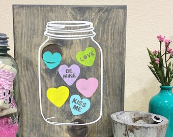 Mason jar with conversation hearts sign