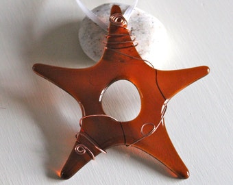 Amber Glass Star Christmas Ornament hung with White Ribbon