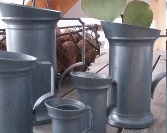Collection of 5 Tin pitchers