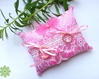 Pink ring-bearer pillow with satin ribbons, laces and beadwork