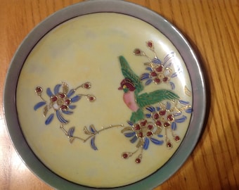 Hand painted ceramic saucer