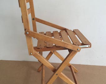 Blond wooden folding chair