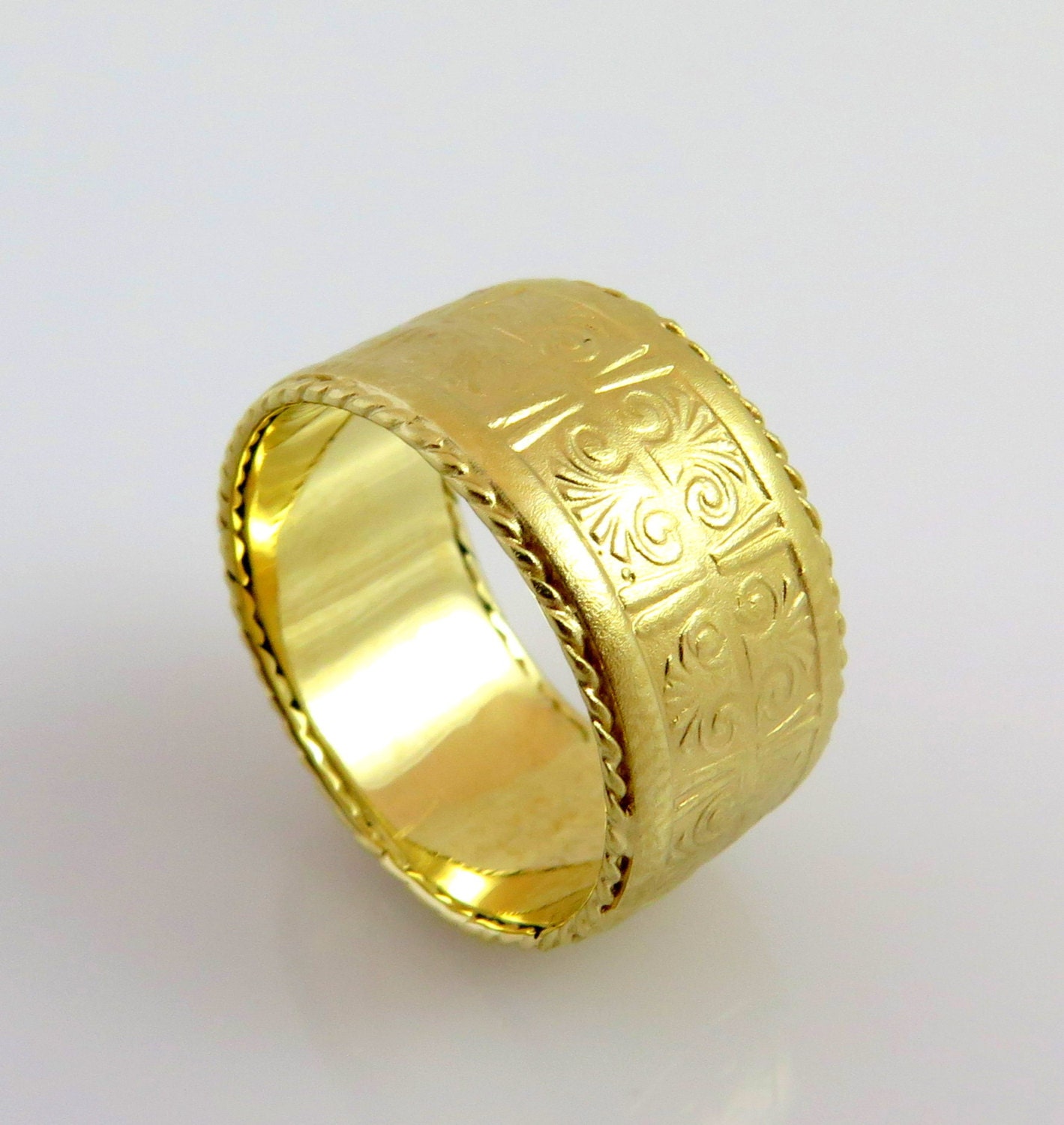 14K Gold Wedding Band Pattern Ring Egyptian Ring Unique This wedding band carved with an Egyptian style pattern band is made of solid 14K yellow Gold. An original and unisex ring with an Egyptian style pattern. The