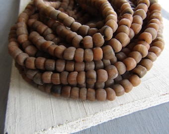 Brown grey glass seed beads , small rustic ethnic spacer , irregular tube barrel indonesia new Indo-pacific 4 to 6mm (22 inch strd) 7ab58-1