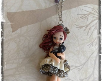Doll con gattino nero