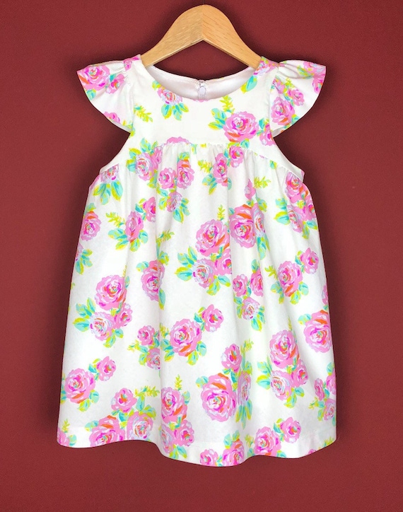 The "Flutter-By Dress" in Neon Rose.