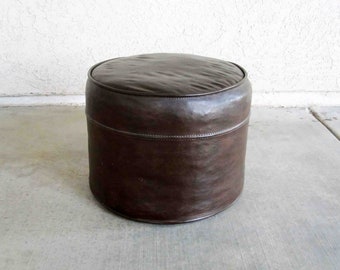 Vintage Mid Century Round Ottoman in Brown. Circa 1960's.