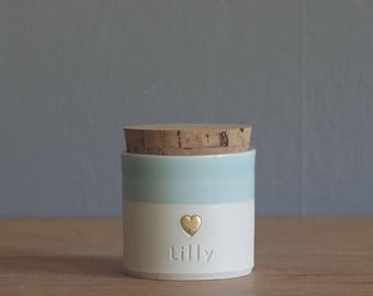 pet urn. straight shaped urn with custom name and stamp. modern urn for ashes. funerary urn. porcelain, ice blue with gold heart shown