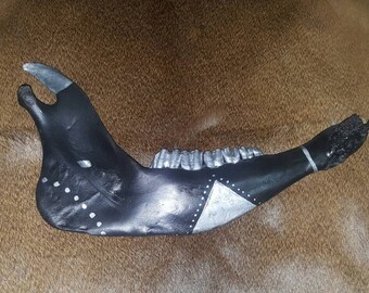 Black and silver tribal jaw bone