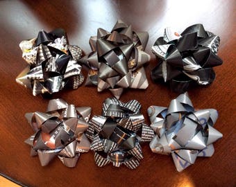 Six neutral toned, recycled gift bows in black and gray