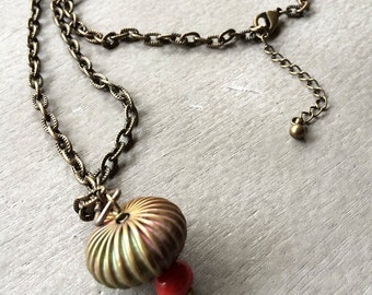 vintage brass orb and ceramic red bead on antiqued brass chain