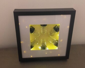 Frame with empty vintage radio/TV tubes