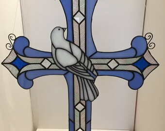 Stained glass sun catcher cross.