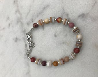 Single strand bracelet with silver accents and Mookaite stones