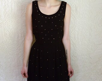 vintage 1960s black dress covered in rhinestones