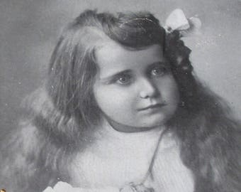 1900s French Postcard, Edwardian girl with long hair. RPPC real photo, paper ephemera.