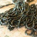 Antique GREEN IRIS Carnival Glass Seed Beads Full Hank Faceted petite hank 10 strands, size 12/0 AB rainbow finish (see Item Description)
