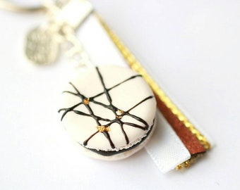 Keychain - realistic white macaroon decorated with chocolate sauce and gold leaf