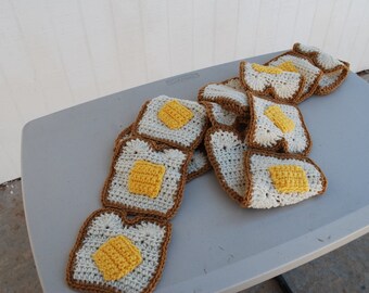 Crocheted buttered toast scarf