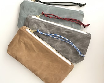 waxed canvas clutch with interior pocket