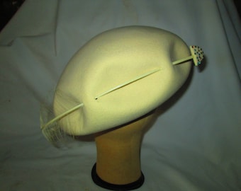 Stunning Ivory Tam Style Hat Pierced with an Arrow and feather Rhinestones Tom Hann Studios
