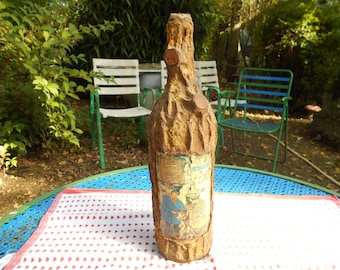 Bottle of cider of Normandy, decorated by hand.