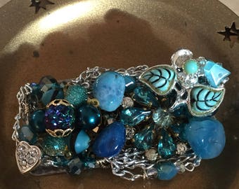Brooch created with blue tone and silver vintage flea market finds