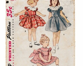A Short, Puff Sleeve, Gathered Skirt, Back Tie, Scallop Trim Dress Pattern for Children: Size 1, Breast 20" • Simplicity 4480