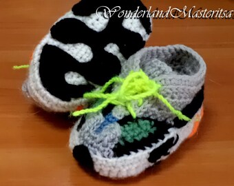 Baby booties. Clothing for children. Handmade. Knitted booties.