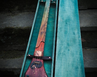 Electric 3-string diddley bow. Fretless guitar by DaShtick guitars. Left-handed guitar.
