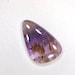 Super seven melody stone cacoxenite in amethyst cabochon