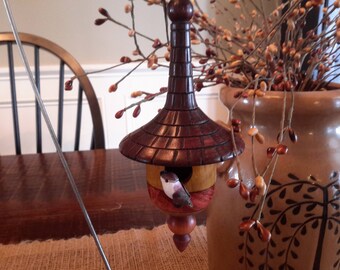 Wood turned handmade birdhouse.