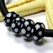 SMAUGGS handmade lampwork bead (1pc, 10mmx5mm), glass, black, white, hole 4 or 5mm