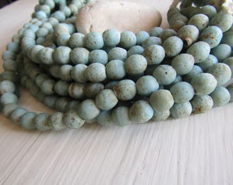 Round lampwork glass beads, rustic light blue with brown wash, opaque matte gritty textured aged look indonesian 9 to 10mm (12 beads)7ak1-2