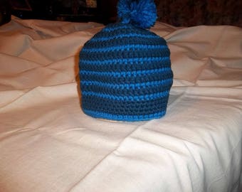 Hat, with tassel, acrylic yarn in shades of blue.